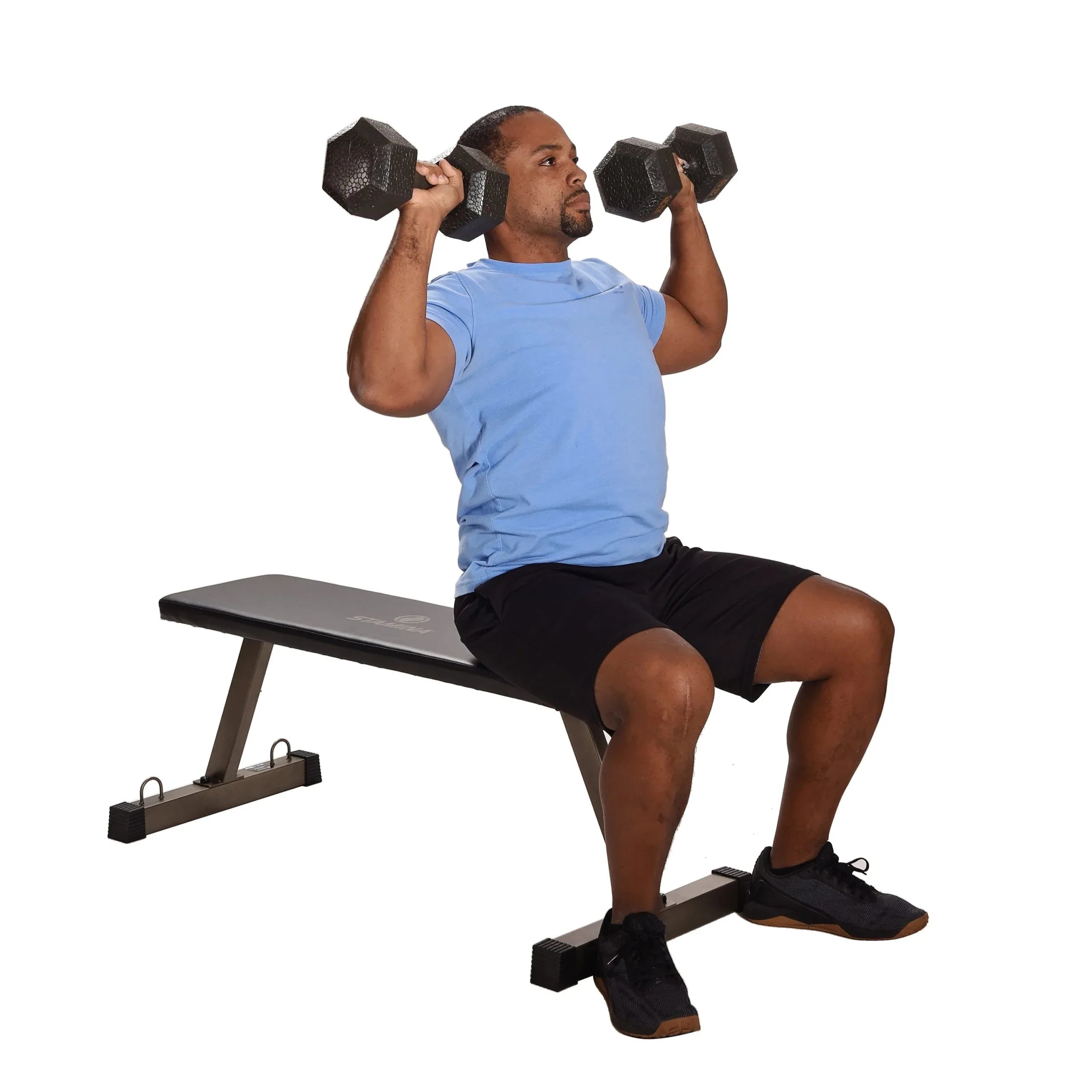Man exercising with dumbbells for upper body weight workouts on a weight bench against a white background