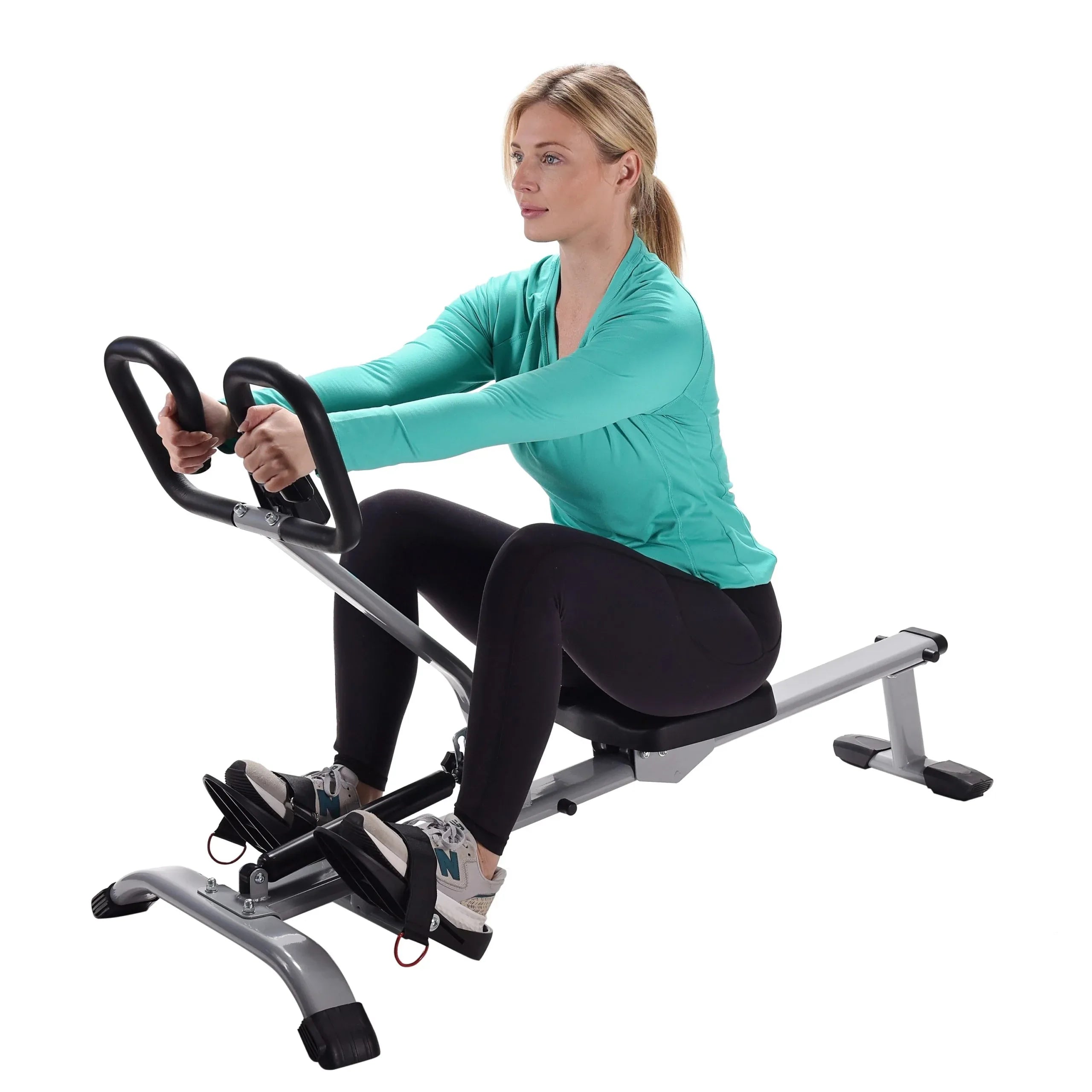 Woman working out on rowing exercise equipment against a white background