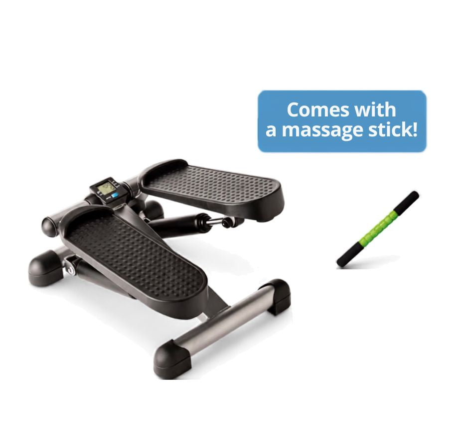 A step platform exercise machine with textured black footpads and a small digital display, shown alongside a blue text bubble reading 'Comes with a massage stick!' and a green-and-black massage stick on a white background.