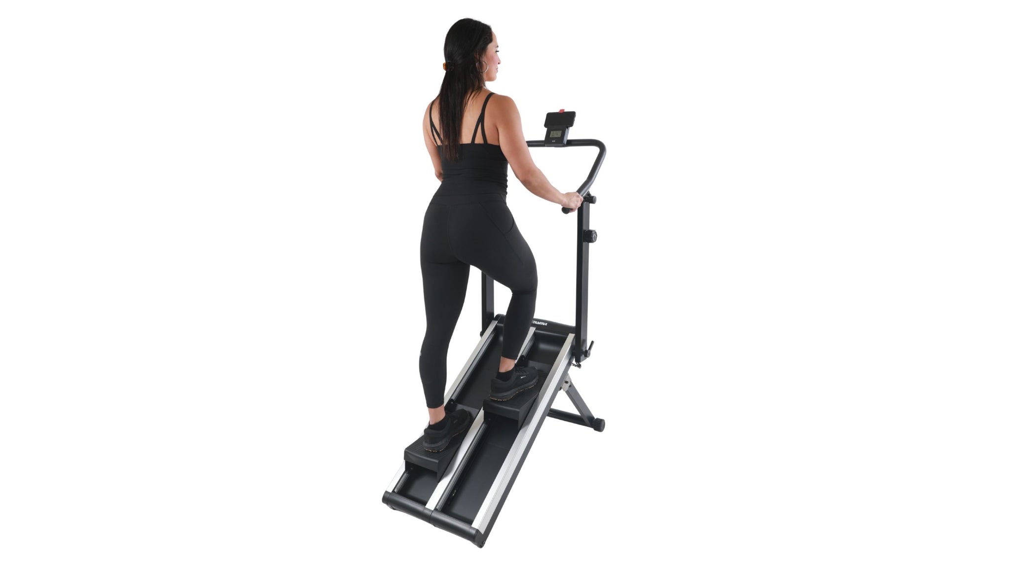Woman using a stair stepper machine on a white background
