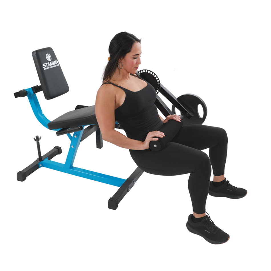 woman using Stamina Leg Extension & Curl Machine