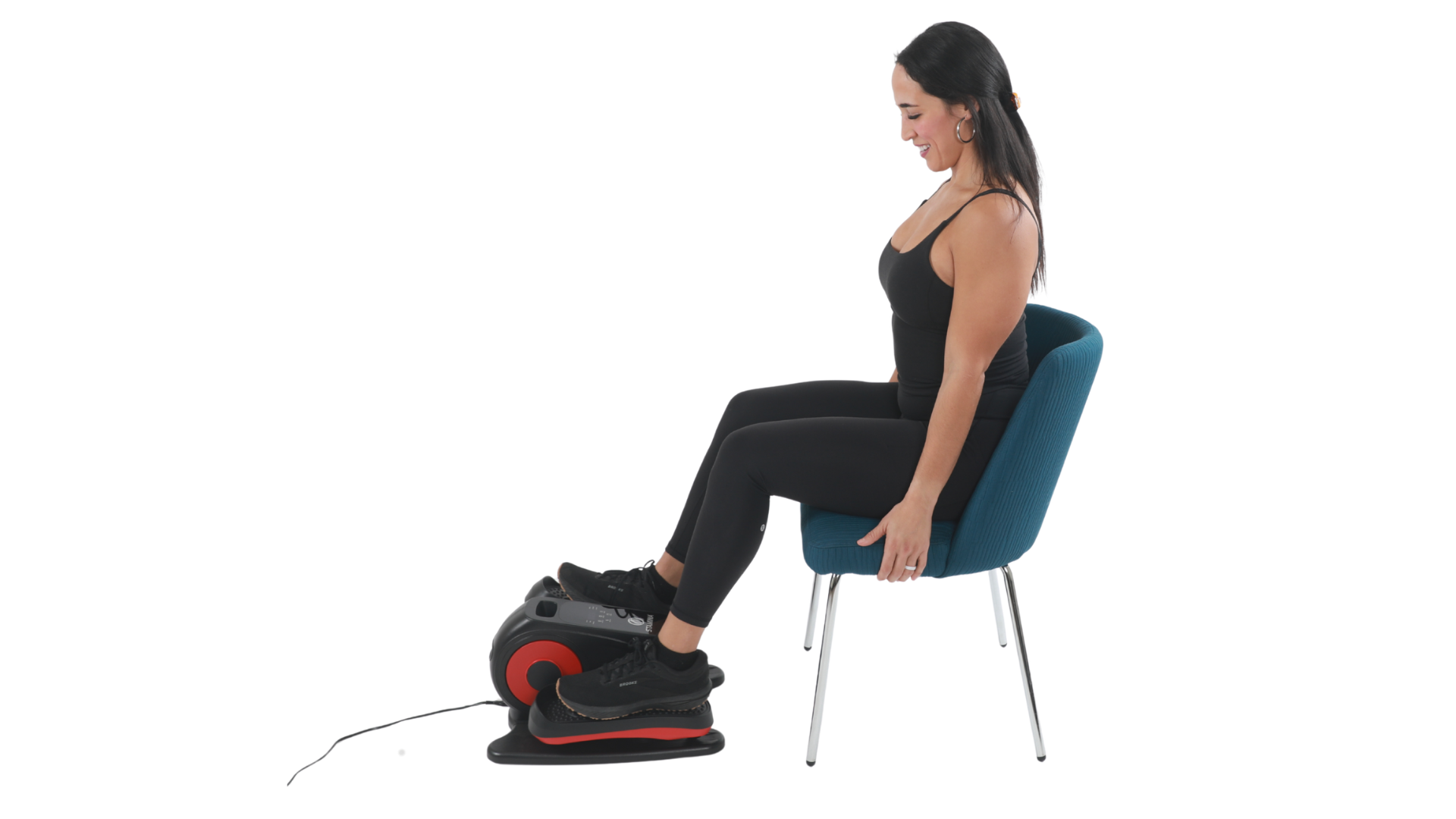 Woman using a seated elliptical machine on a white background