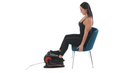 Woman using a seated elliptical machine on a white background