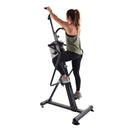 Woman using a black stair stepper machine for home on a white background