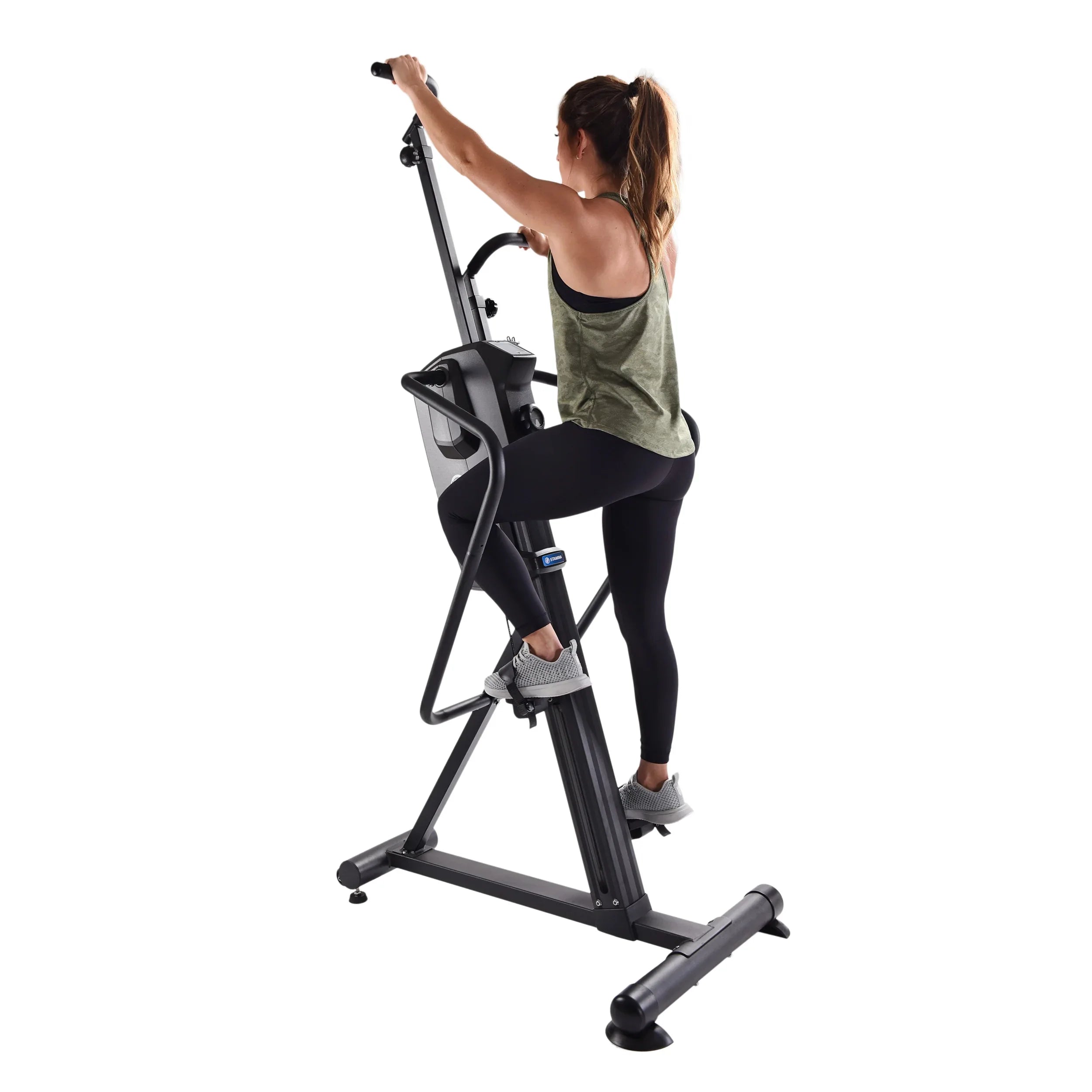 Woman using a black stair stepper machine for home on a white background