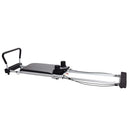 Pilates reformer machine on a white background