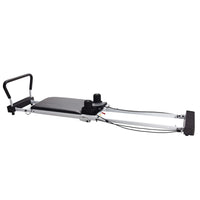 Pilates reformer machine on a white background