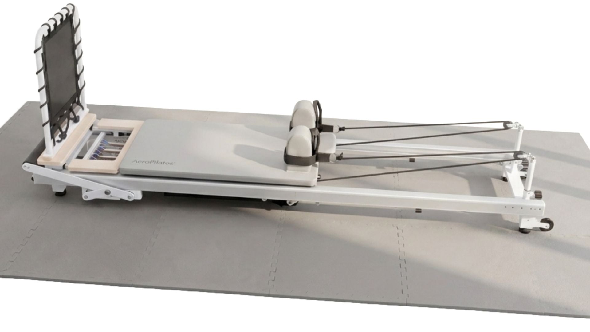 Pilates reformer machine on a white background for strength training, flexibility main image