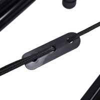 Close-up of a black metal clip attached to a black cord on a white background