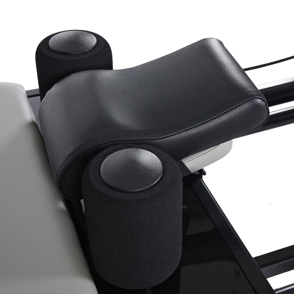 AeroPilates Premier Studio 701 Close-up of a black leather armrest on a vehicle seat with a white background