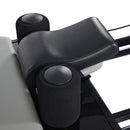 AeroPilates Premier Studio 701 Close-up of a black leather armrest on a vehicle seat with a white background