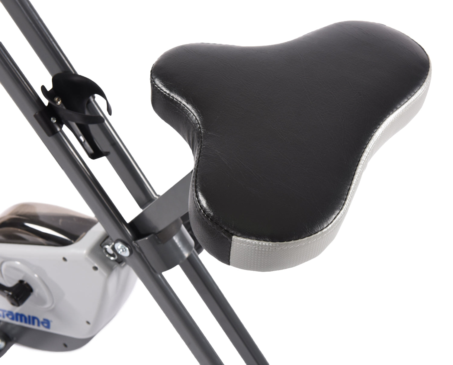 Close-up of a black exercise bike seat with a white background