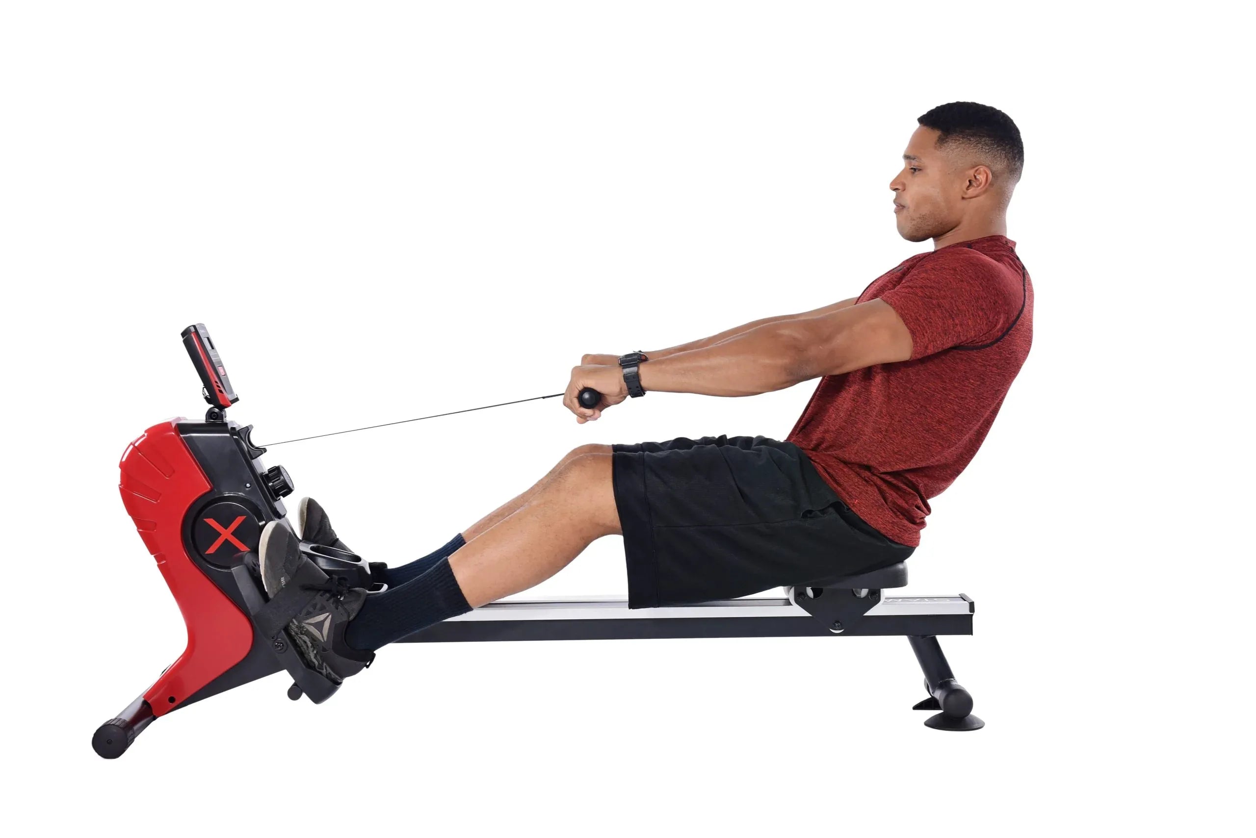 Man using a portable rowing machine on a white background