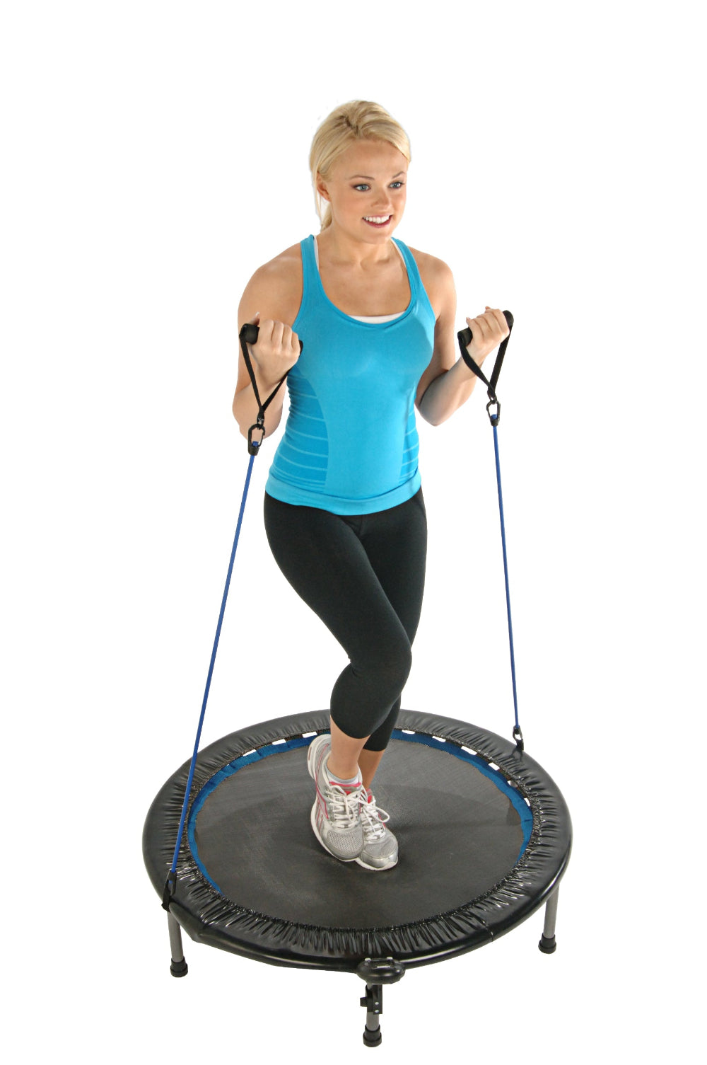 Woman exercising on a trampoline with resistance bands in a home gym in a white background