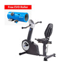 A black and gray recumbent exercise bike with a digital display and padded seat, shown on a white background. A red banner at the top reads 'Free EVO Roller,' and an inset shows a blue EVO roller tube accessory.