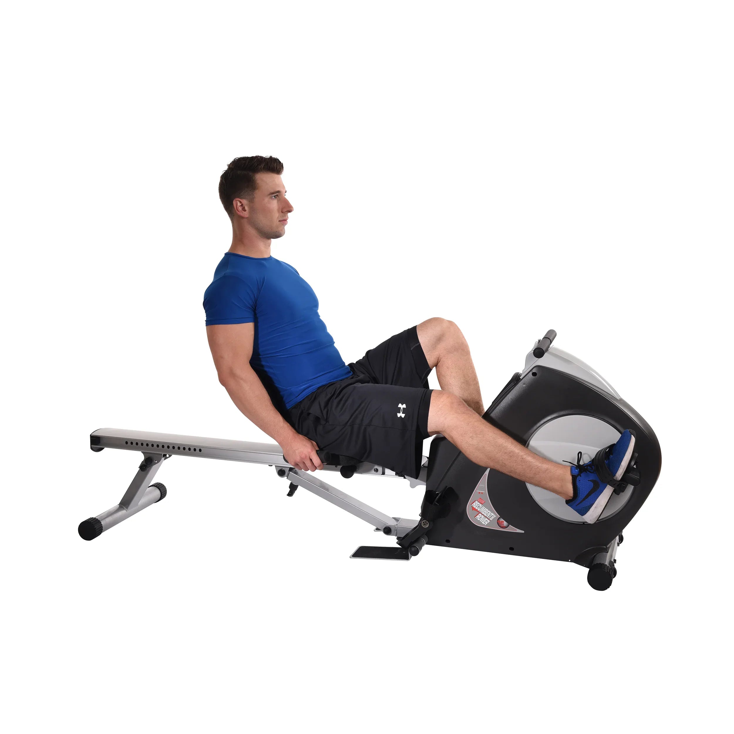 Man using a recumbent bike exercise equipment on a white background