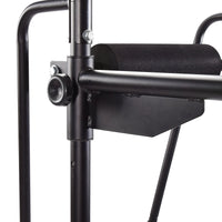 Close-up of a black Stamina Power Tower 1698 stand with a cylindrical component on a white background