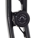 Tension control knob on a piece of exercise equipment with a white background