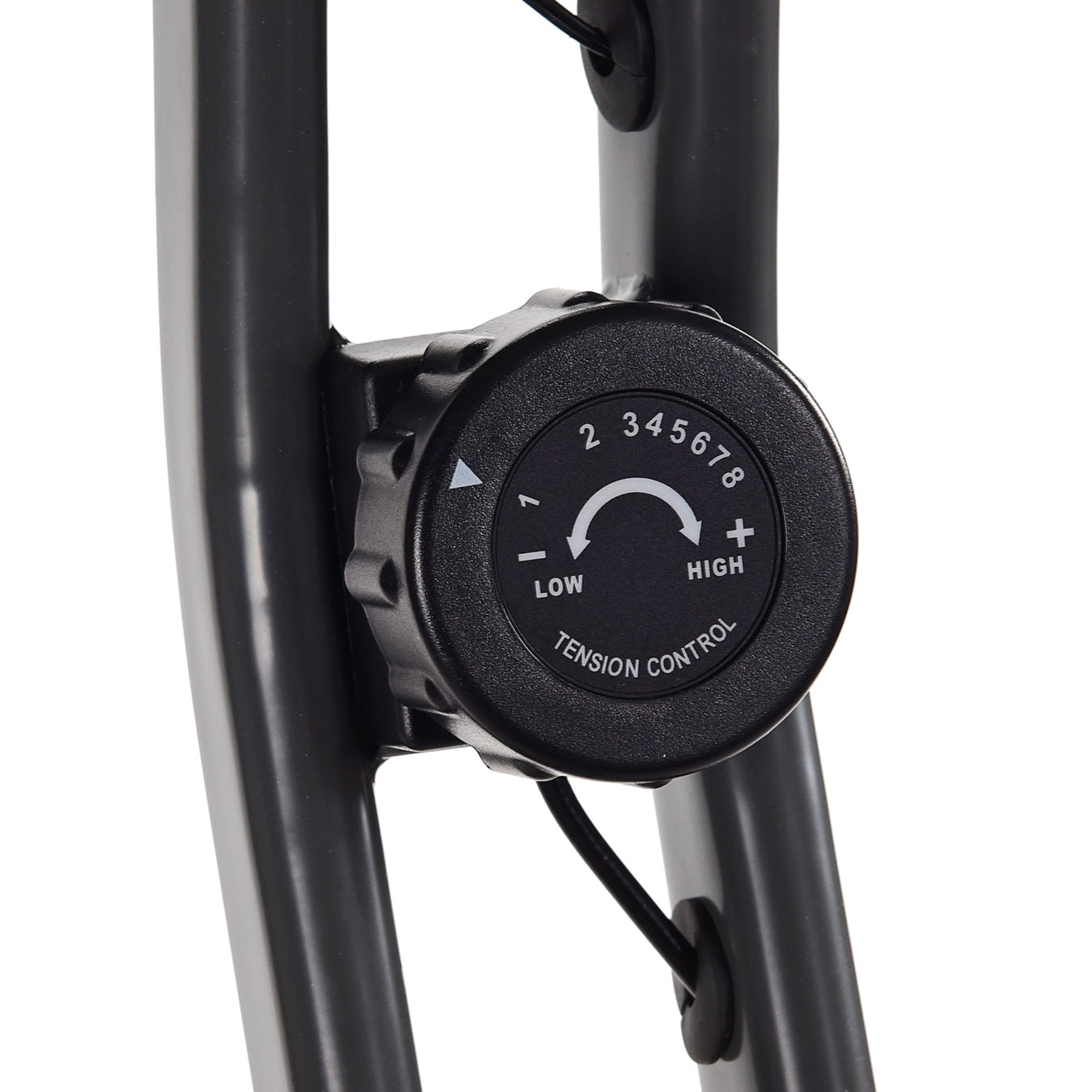 Tension control knob on a piece of exercise equipment with a white background