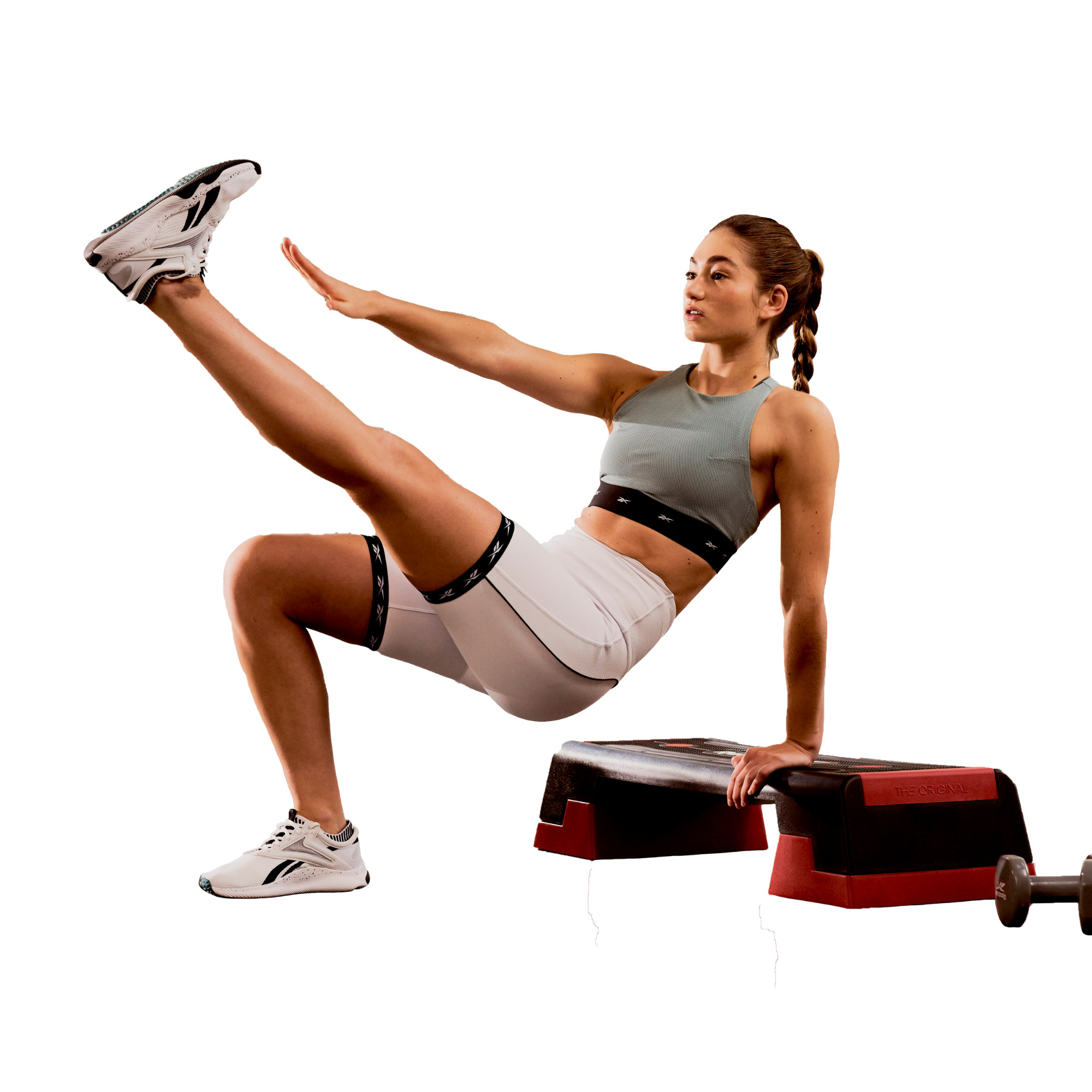 Woman exercising with a step platform on a white background
