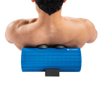 Person using a blue foam roller on their back with a white background