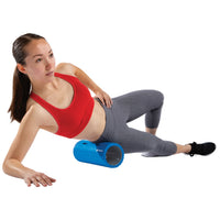 Woman using a blue foam roller on a white background