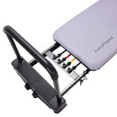 Aeropilates reformer with attachments on a white background