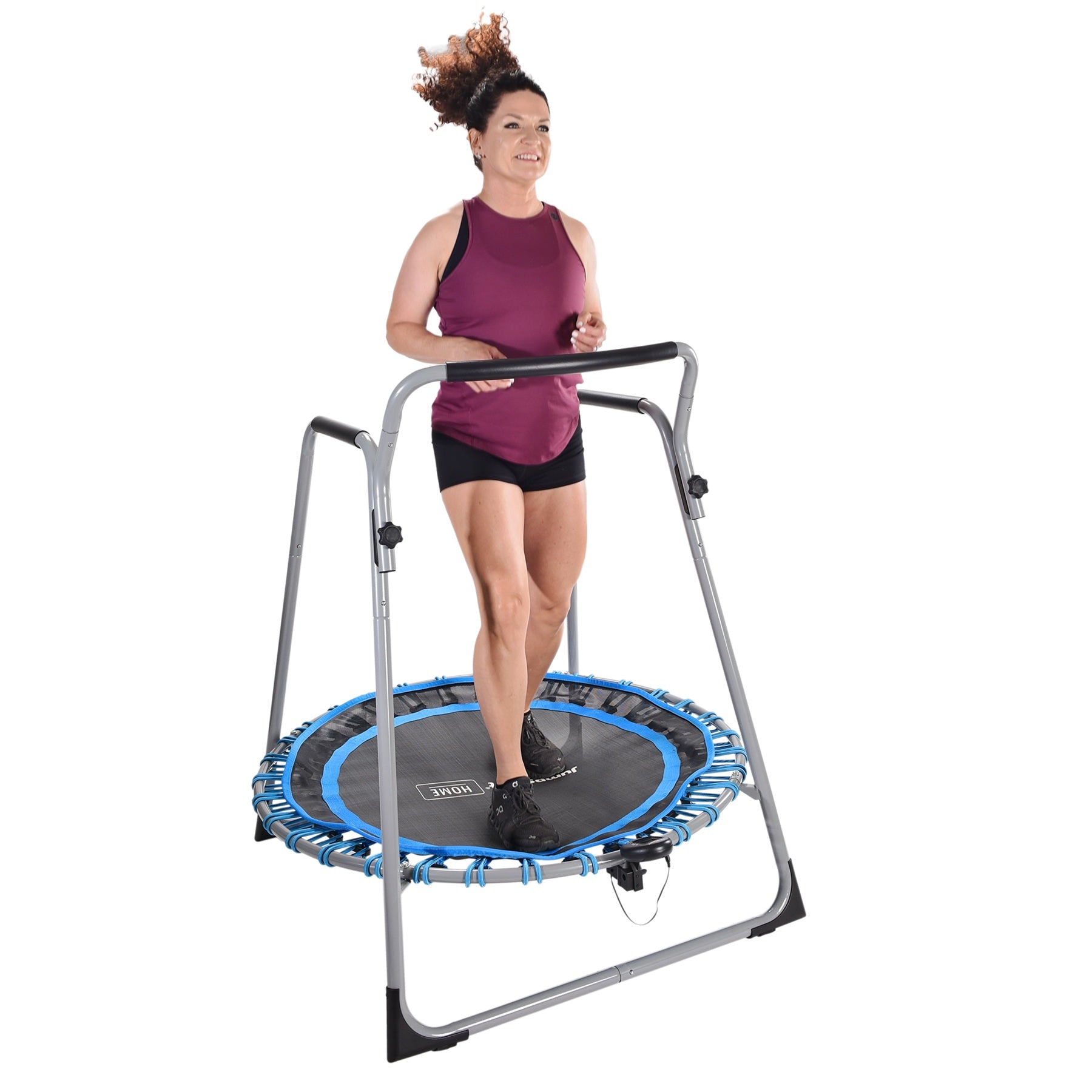 Woman exercising on a rebounder with a white background