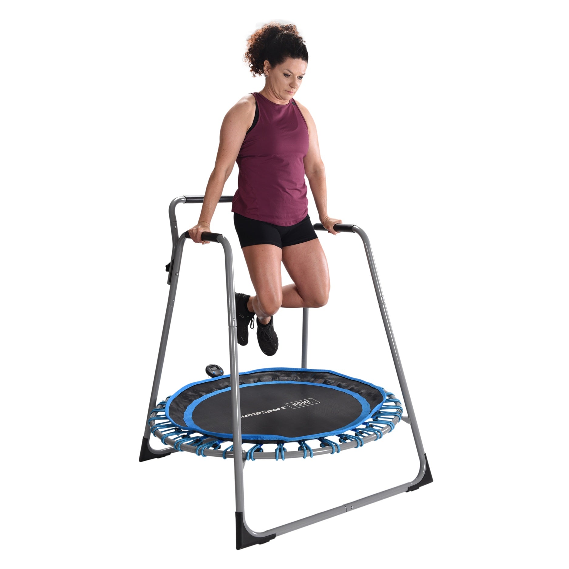 Woman exercising on a rebounder with a stand against a white background