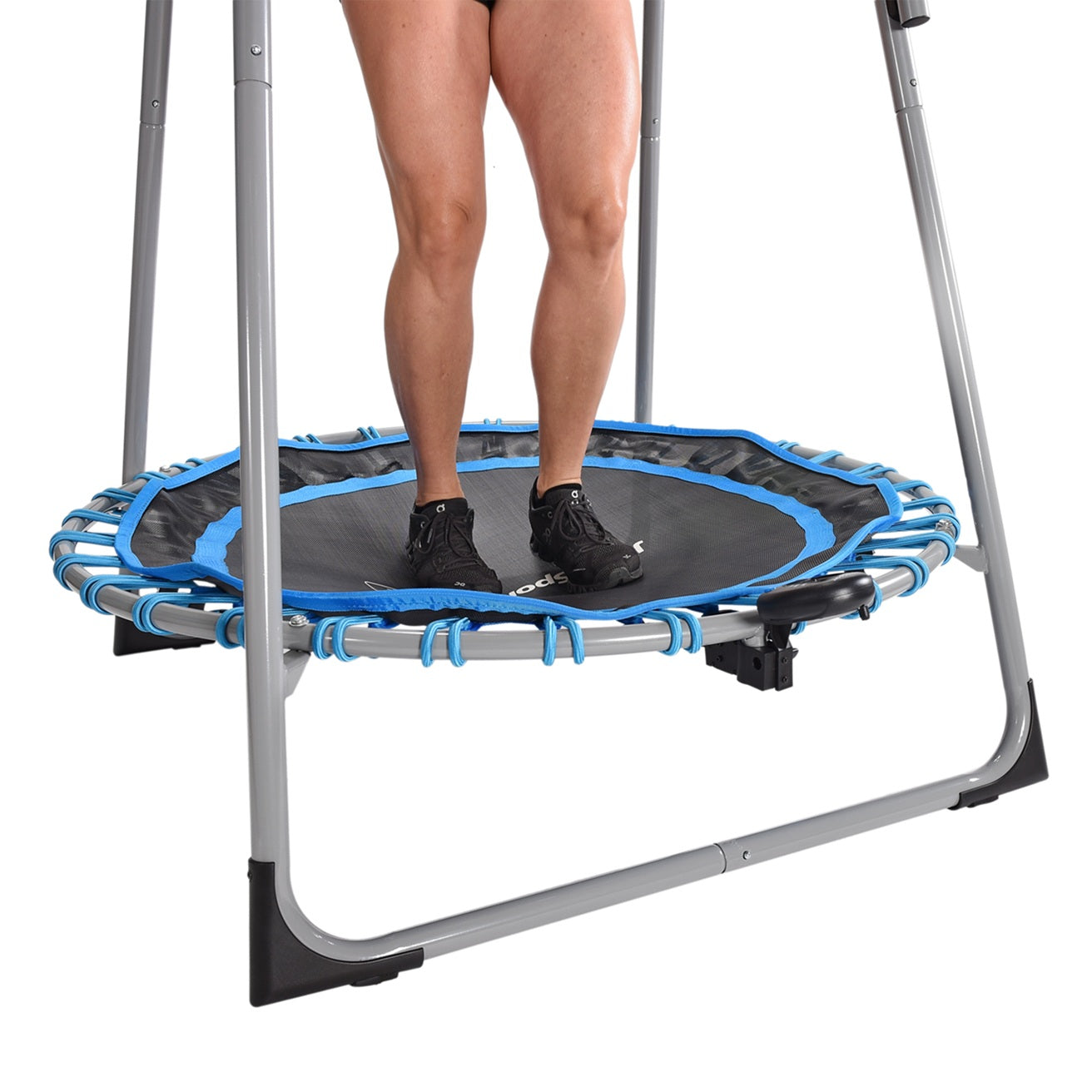 Person standing on a small trampoline with blue border on a white background