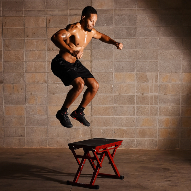 Man performing Plybox jump on Stamina Adjustable Plyo Box.
