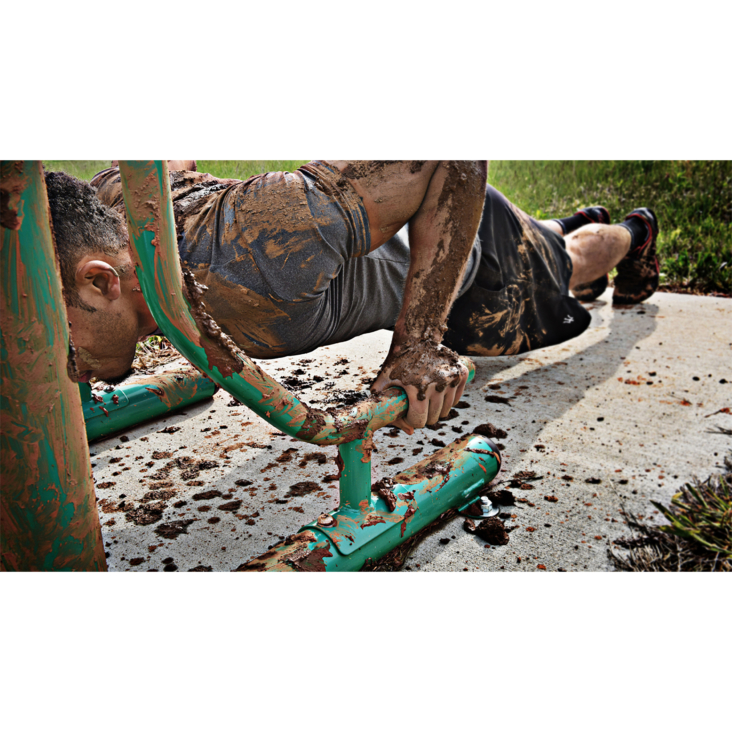 Muddy man workout on Stamina Outdoor Fitness Power Tower