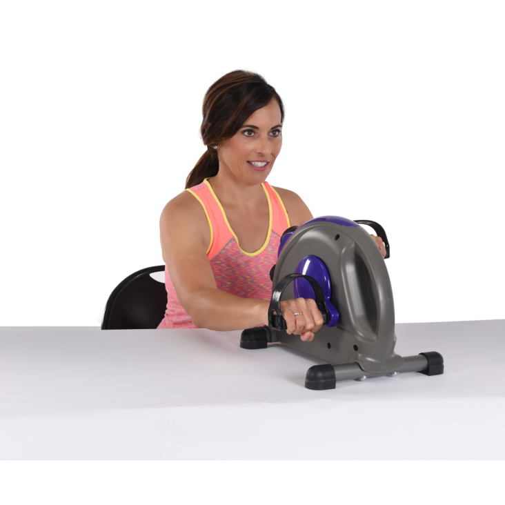 Woman workout her hands on Purple Stamina Mini Exercise Bike with Smooth pedal System