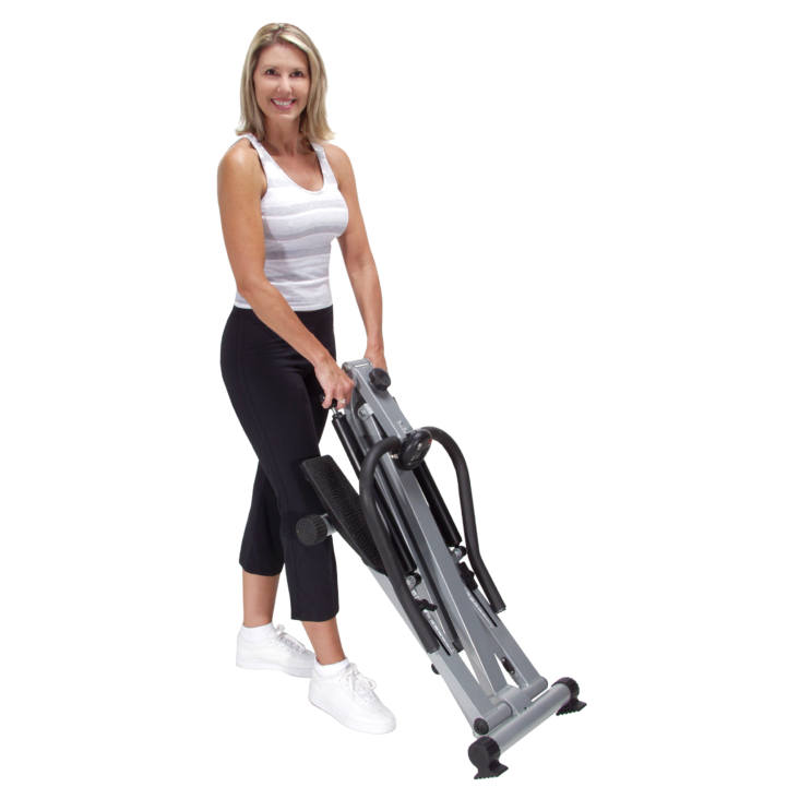 Woman holding on foldable Stamina SpaceMate Folding Stepper