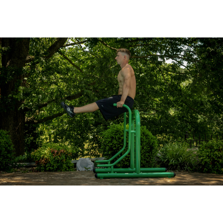 Man performing triceps dips on Stamina Outdoor Fitness Multi-Station