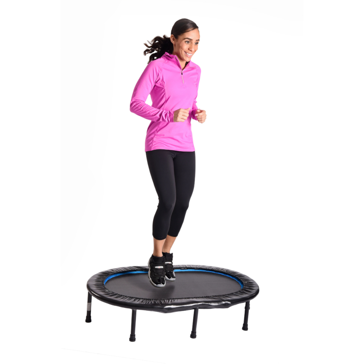 Woman performing exercise on Stamina Oval Fitness Trampoline.