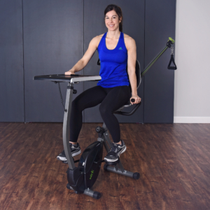 Woman cycling on WIRK Bike and Strength System.
