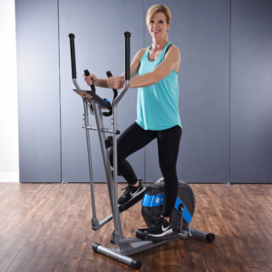 Woman smiling and stepping on Stamina Elliptical – HIIT Workout.
