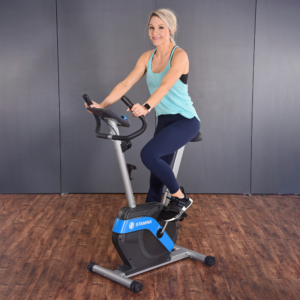 Woman cycling on Stamina Upright Bike – Cardio + Strength Workout.