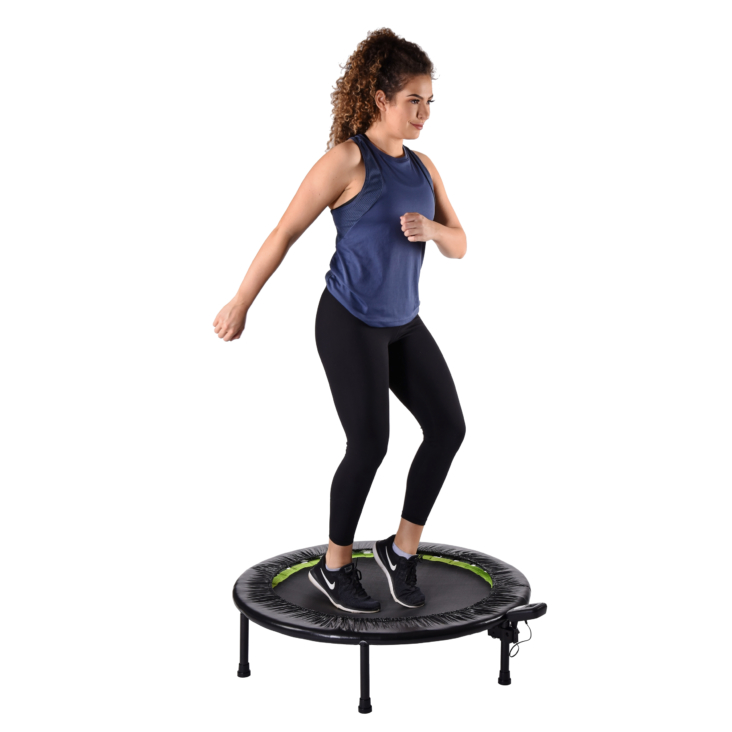 Woman arm straight downward while using trampoline.