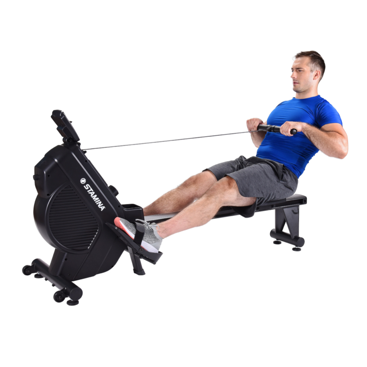 Man cycling and seated on Rowing Machine while pulling the handle bar.
