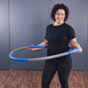Woman perform the Fitness Hoop.