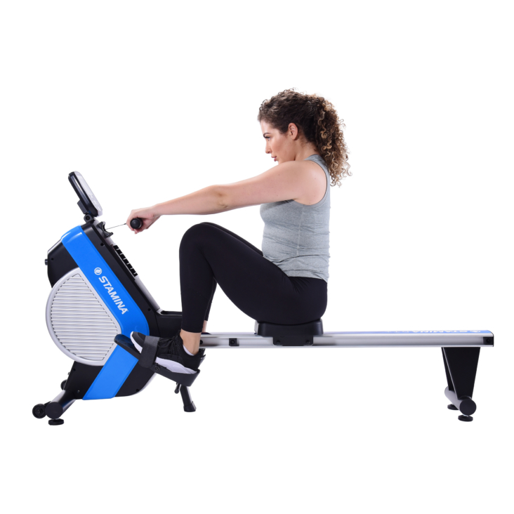 Woman seated on Stamina DT Plus Rowing Machine.
