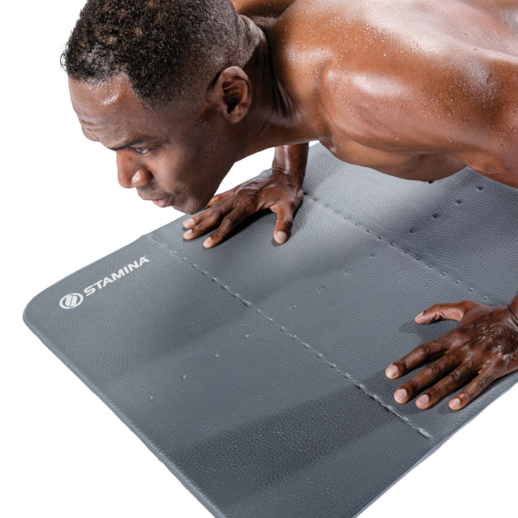 Man doing a push-up on exercise mat