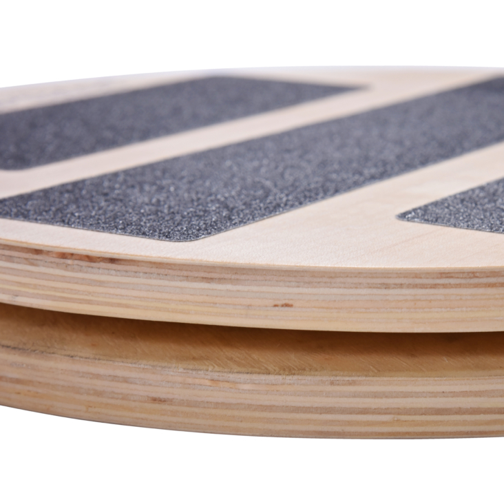 Close up of precision wooden rotational disk pilates equipment