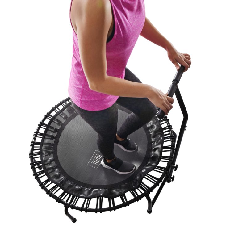 Woman stepping on JumpSport Home Fitness Trampoline 120