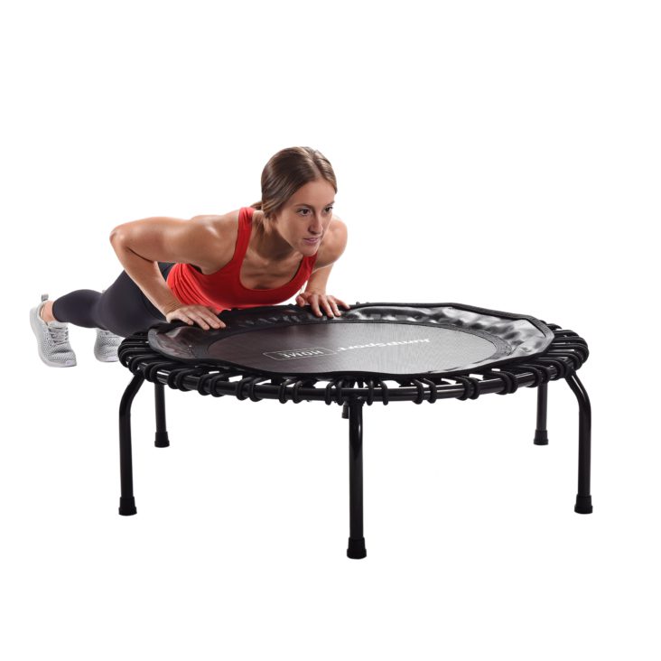 Woman push up on Jumpsport Home Fitness Trampoline 105