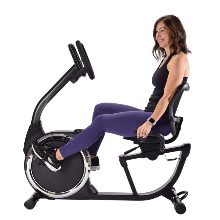 Woman cycling on Magnetic Exercise Bike 345